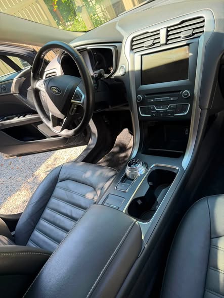 Spotless front seats and center console after detailing